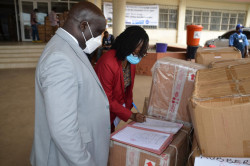 Dr. Jallah receiving donated supplies from WHO.jpg